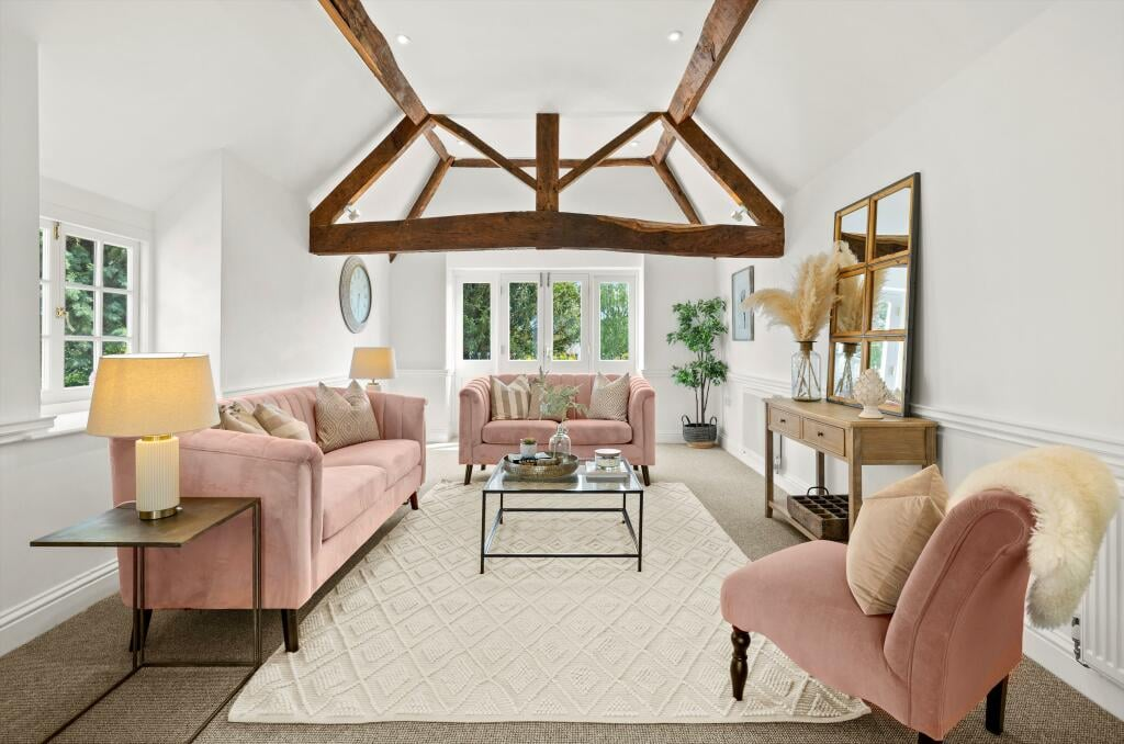 Finished living room with restored exposed oak roof trusses