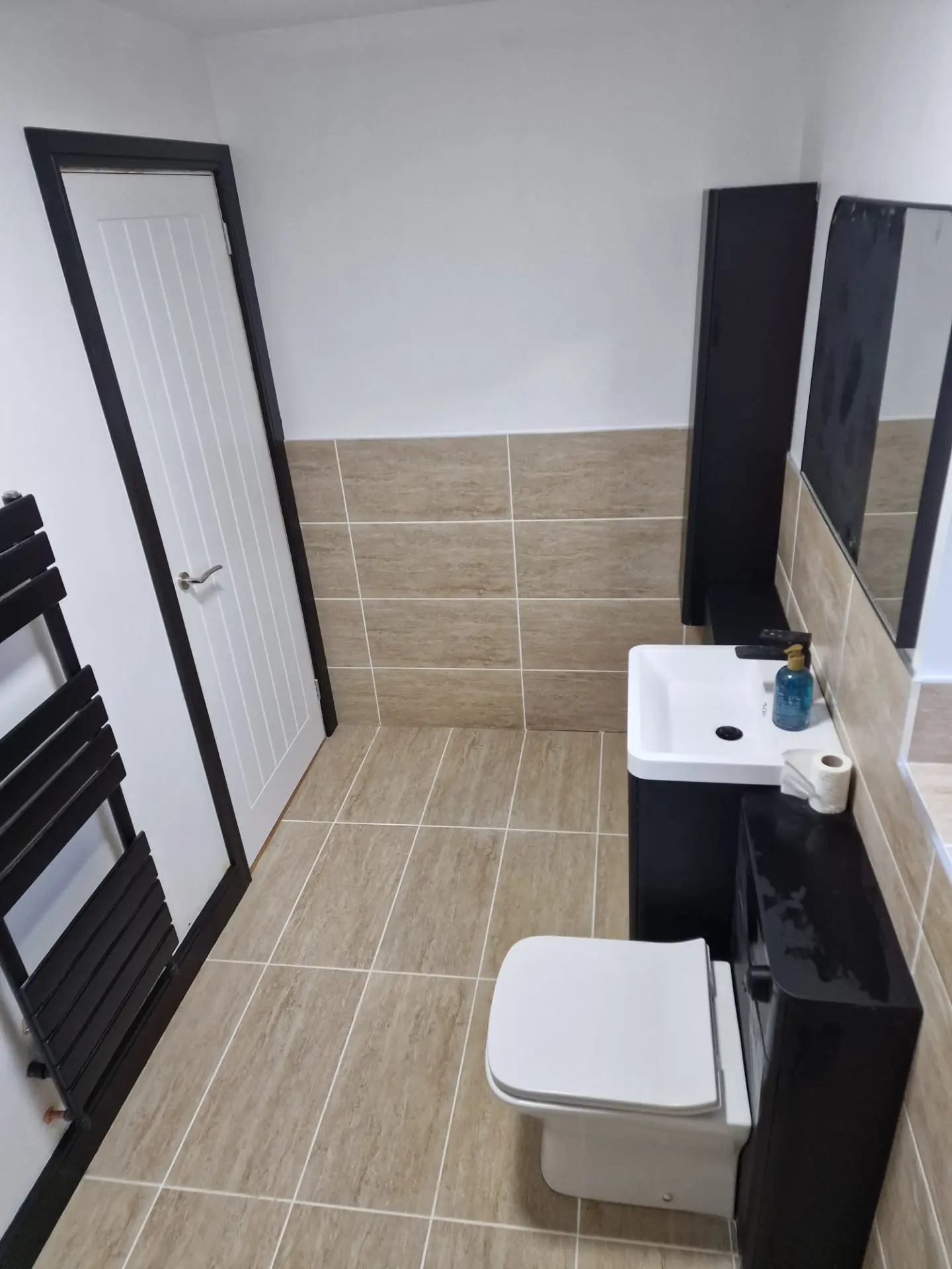 Completed bathroom fit out with tiling and joinery